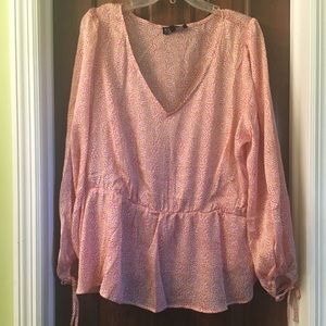 Eloquii coral print elastic waist blouse.